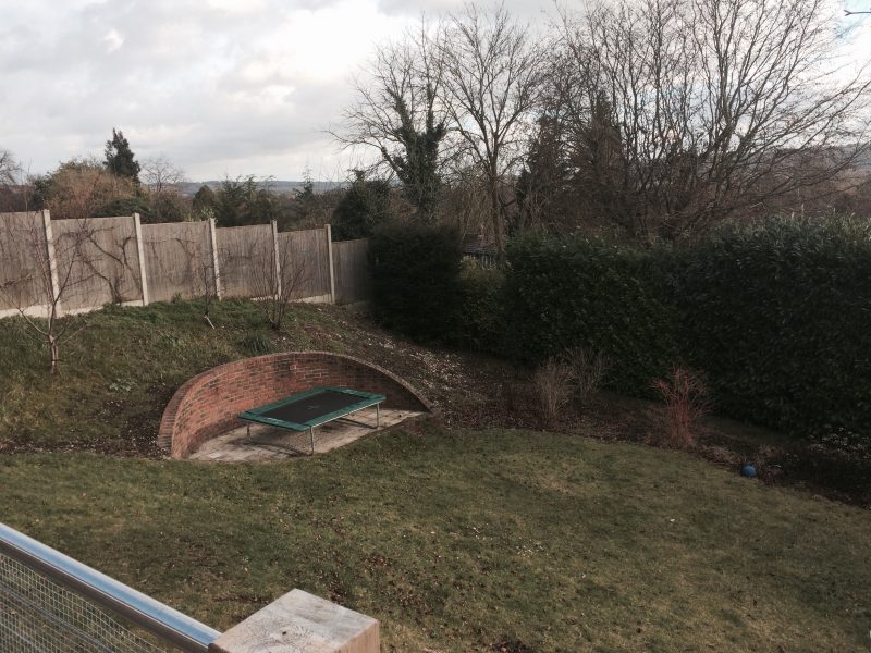 sloped lawn area before landscaping