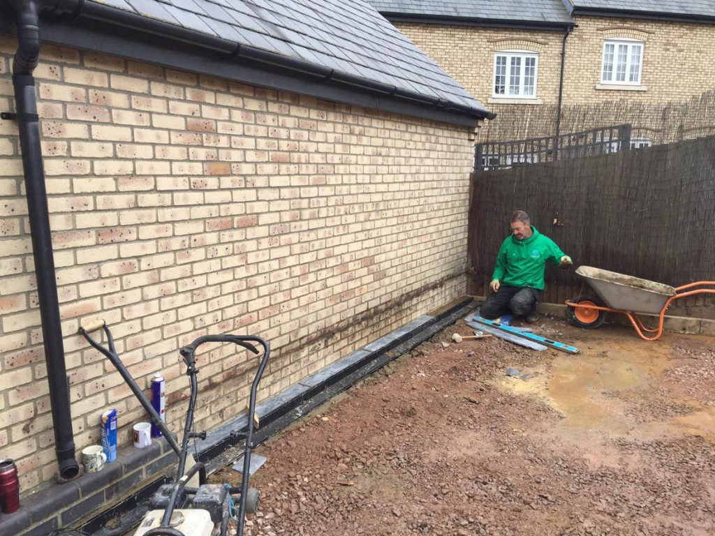 excavating area for laying patio