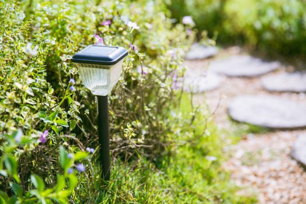home garden walkway with solar cell light pole.