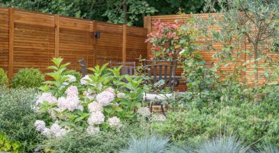Slatted wood fence and flowers