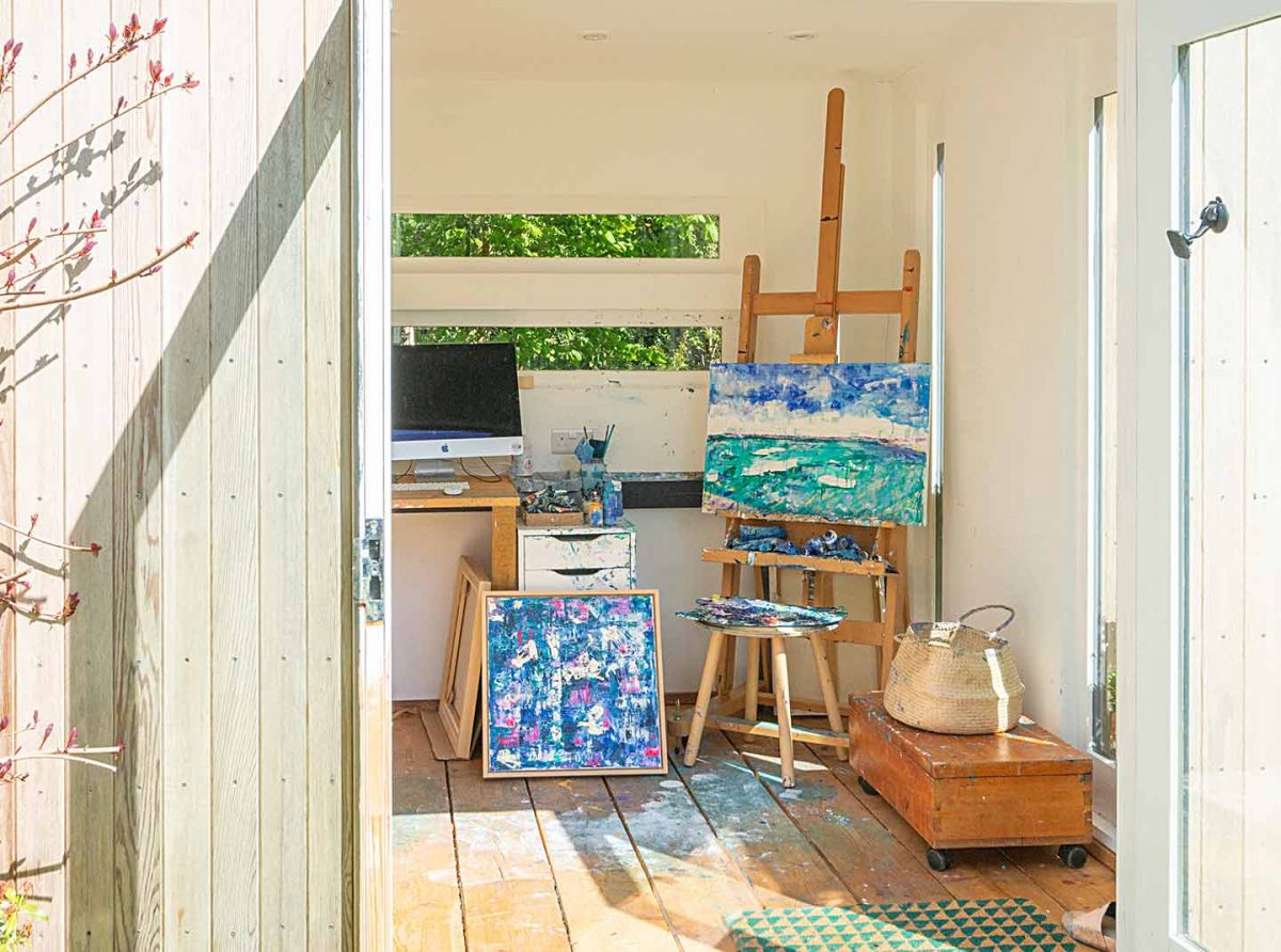 Artwork on easel in artists garden studio