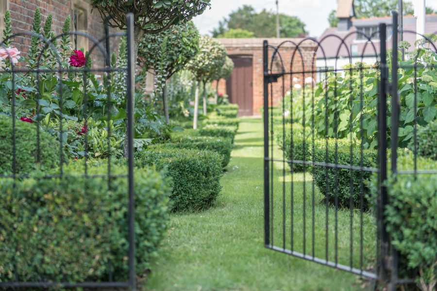 Gate leading into topiary garden