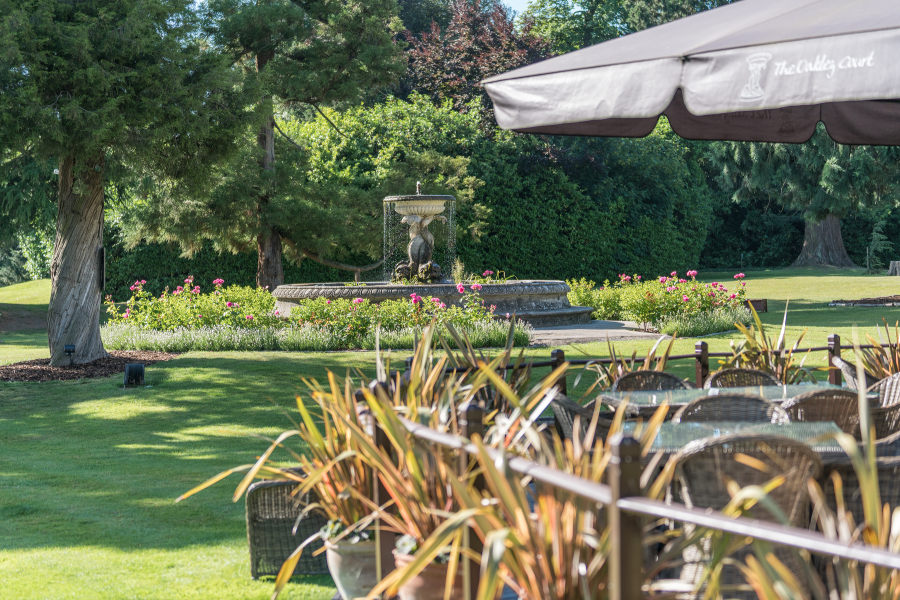 View over grounds from outdoor dining area Oakley Court Hotel