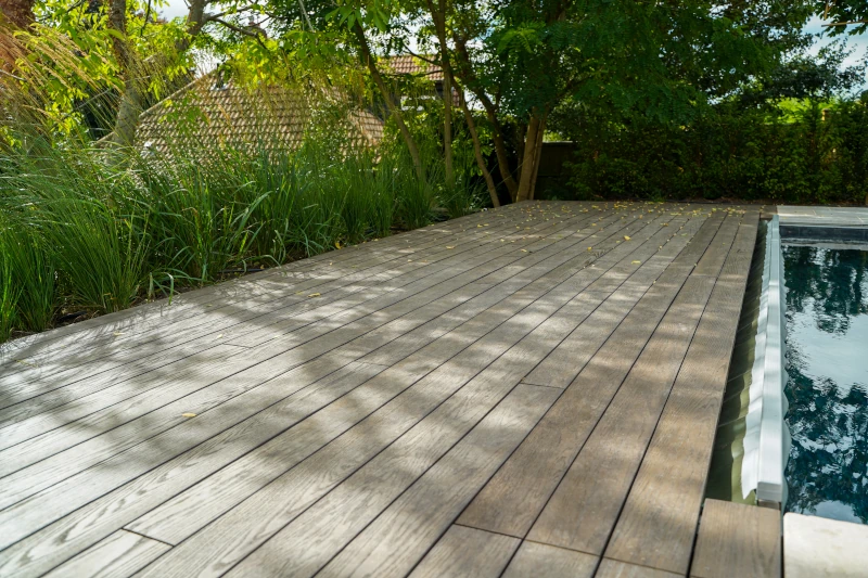 Water resistant anti-slip composite decking next to pool